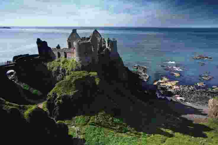 Dunluce Castle situated on cliffs of Causeway Coast