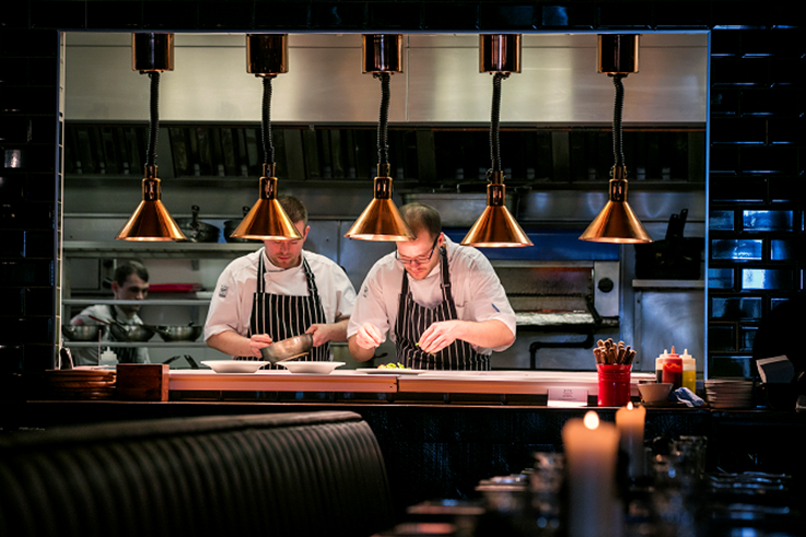 Chefs preparing dishes of food to be served in the Coppi restaurant. Located in Belfast’s buzzing Cathedral Quarter, Co Antrim.