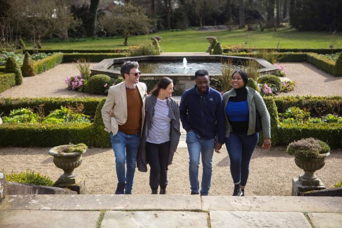 two couples take in the scenery of the Hillsborough castle gardens