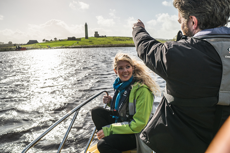 Visitors voyaging by boat to Devenish Island as part of Erne Water Taxi experience.