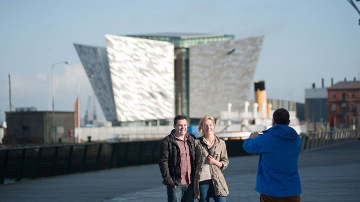 Couple taking photographs of Titanic Belfast & SS Nomadic