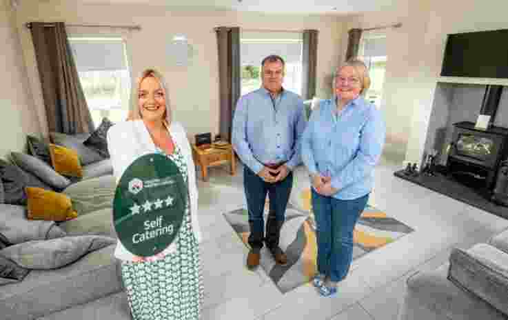 Pictured at Newell’s Cross Cottages based in Co. Down is Deborah Avery, Senior Quality Adviser at Tourism NI (left) alongside the owners, Joanne and Frank Newell. 