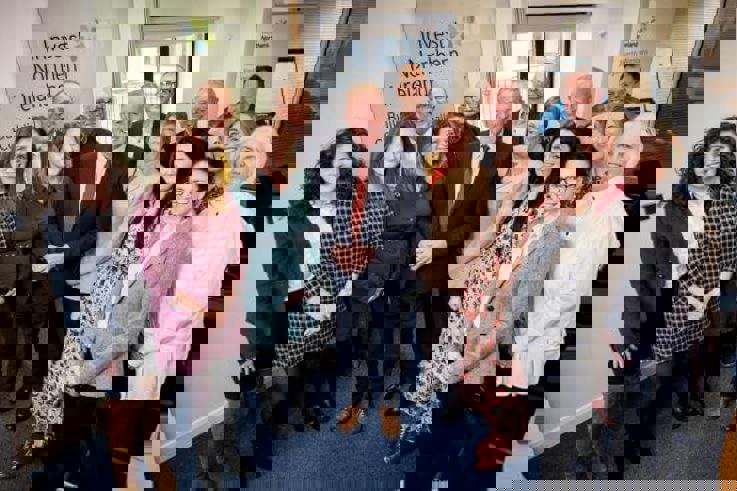 A man pictured in Invest NI's North West Regional Office in Derry with business representatives. 